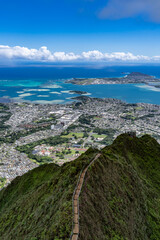 Haiku Stairs (Stairway To Heaven), Honolulu, Oahu, Hawaii. Koʻolau Range, shield volcano. Kāneʻohe Bay is argest sheltered body of water in the main Hawaiian Islands. This reef-dominated embayment
