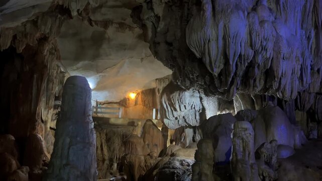 Wang Vieng, Laos.Tham Jang Cave-stalactites and stalagmites in a karst mountain with a Buddha temple inside. There is a spring inside the cave. The cave is equipped with comfortable paths and lanterns