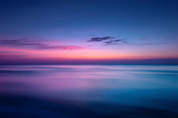 Fototapeta premium Sunset Over Calm Ocean with Gradient Sky from Pink to Deep Blue Horizon Peaceful Scene