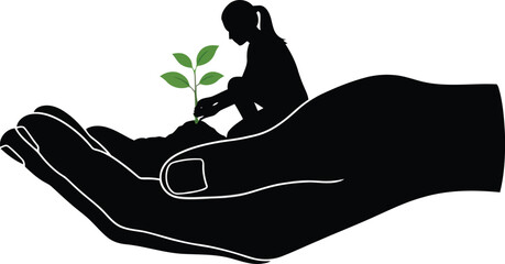 Silhouette of person planting seedling in cupped hands 1