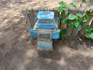 Wood fance on the Sandy soil with bricks poll 