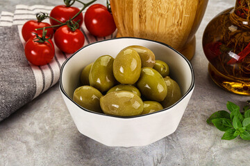 Big green marinated olives in the bowl