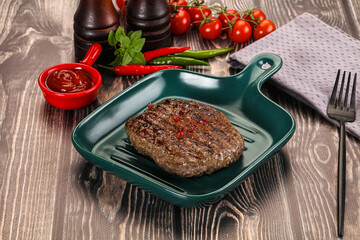 Grilled beef burger cutlet with sauce