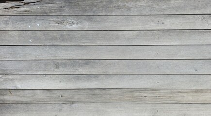 Obraz premium Old wood surface peeling and decaying over time, garden balcony floor, horizontal wooden planks, texture image. Weathered white painted wooden planks.