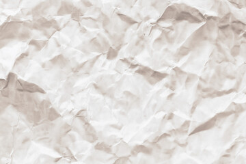 Tan crumpled paper it may be a background texture. Suitable for graphic design projects, presentations, and social media posts. Tan crumpled paper for textured backgrounds and artistic overlays.