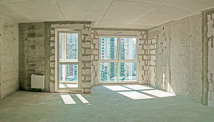 Inside Interior View of Newly Built Apartment With No Decoration in Bright White Colors With Rough Finish.