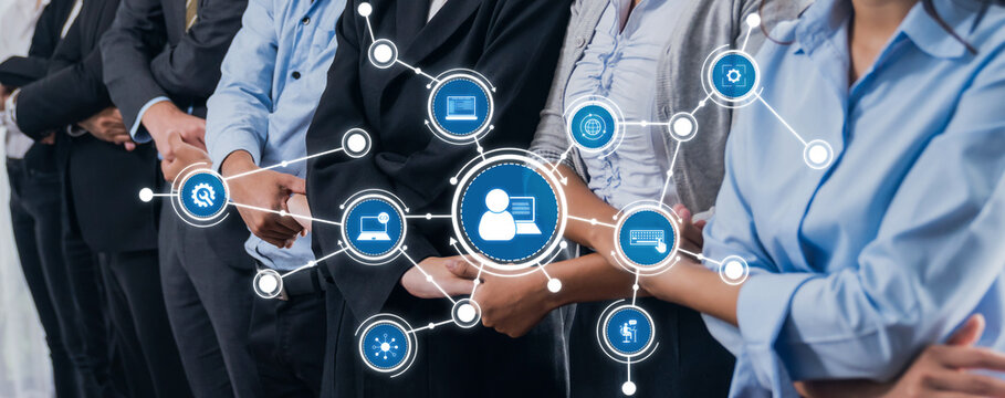 A diverse group of professionals stands together, showcasing connections and collaboration in a digital age, emphasizing technology role in modern business relationships. Amity - Powered by Adobe