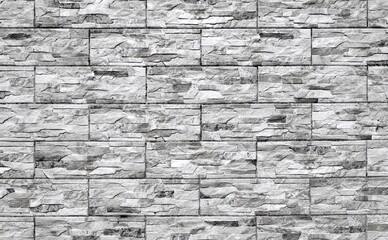 External wall covering made of stoneware  with rock effect. Colors are shades of gray . Background and texture.