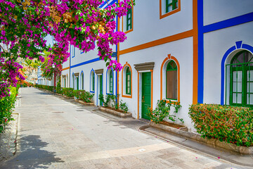 Naklejka premium Travel Concepts. Alley of Village in The Area of Puerto de Mogan at Daytime at Gran Canaria in Spain Called a Little Venice of the Canaries.