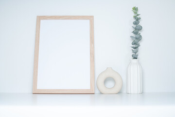 Minimal Home Decor Mockup with Blank Picture Frame and Modern Ornaments