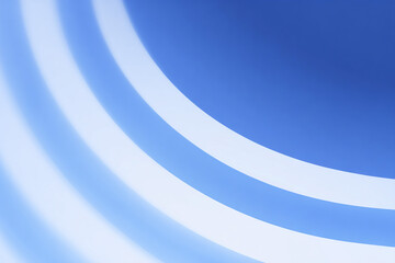 Abstract blue and white diagonal rounded lines background