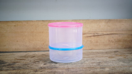 Plastic cookie jar with clear lid for storing snacks or homemade cookies, perfect for kitchen organization and food storage