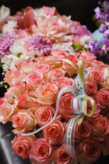 Beautiful bouquet of pink roses with delicate ribbon