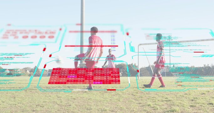 Preparing player in striped jersey controlling soccer ball in park field with goal and HUD overlay - Powered by Adobe