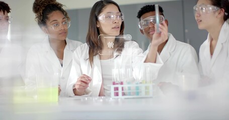 Examining woman holding test tube at lab bench with multicolored rack, wearing goggles and lab coat