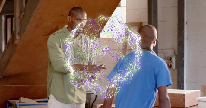 Observing two technicians examining glowing portal ring inside workshop area, with wooden staircase - Powered by Adobe