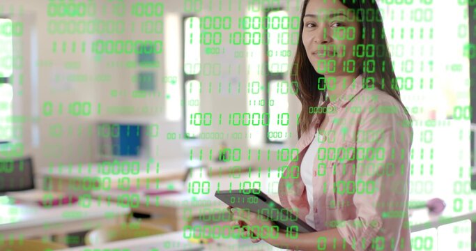 Holding tablet instructor wearing pink shirt showing green binary overlay in classroom, copy space - Powered by Adobe