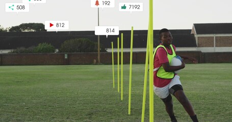Running teen in neon bib holding white-blue ball on pitch, with yellow poles overlays, copy space