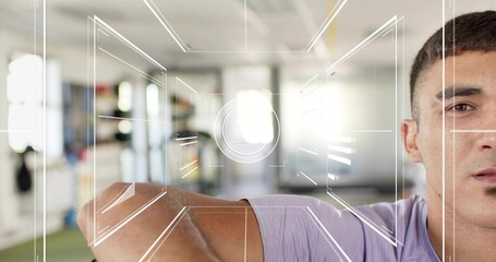 Raising man showing right-side face, arm crossing at gym in purple tee, HUD overlay, copy space
