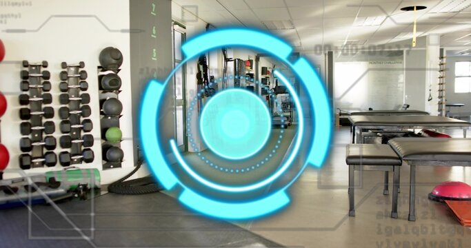 Fototapeta Displaying cyan AR circular HUD over rehab gym, revealing dumbbell rack, medicine balls, tire