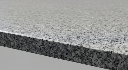 Close-up of a granite countertop showing its texture and edge profile.