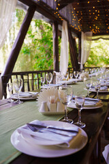 Elegant dining setup in a lush outdoor location