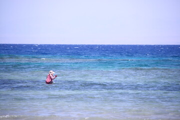 Bedouin woman walking in Sinai, Red Sea traditional Middle Eastern culture and lifestyle