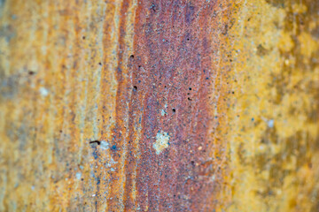 Abstract background of a rusty red and yellow metal surface, macro
