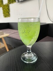 Es Timun Serut is made with shredded cucumber, lime juice, sugar, and water, often served with ice. Some variations of the drink also include basil seeds or melon syrup. fresh tropical drink concept.