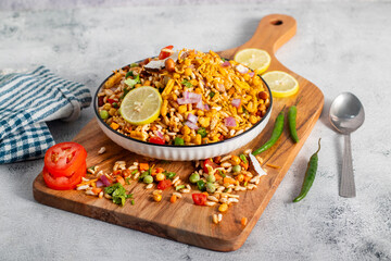 "Jhalmuri", a spicy Bengali street snack made with puffed rice, mustard oil, onions, chilies, and tangy spices for crunch and flavor.
