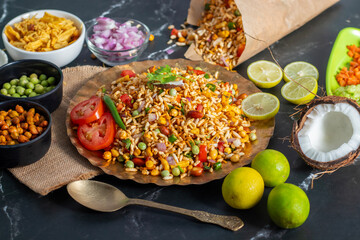 "Jhalmuri", a spicy Bengali street snack made with puffed rice, mustard oil, onions, chilies, and tangy spices for crunch and flavor.
