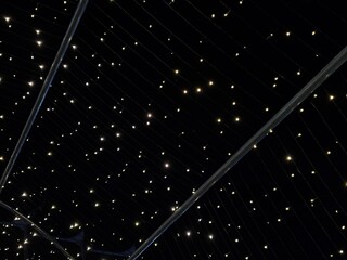 Starry Light Canopy at Night – Decorative String Lights Creating a Cosmic Ambiance