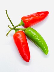  top view organic red and green chilli on white background. 
