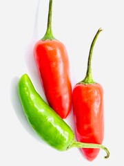  top view organic red and green chilli on white background. 