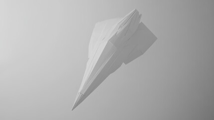 A monochrome origami paper airplane gliding over soft layered gray shadows