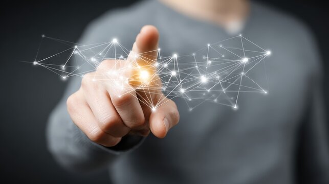 Person interacts with glowing abstract digital network structure using index finger