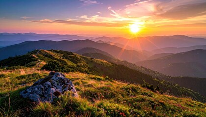 Golden Sunrise Over Rolling Mountain Peaks With Distant Cityscape Silhouetted Against A Vibrant Orange Sky And Sun Rays