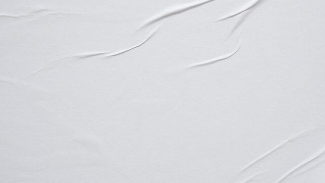white crumpled and creased glued wrinkled paper poster texture background stop motion
