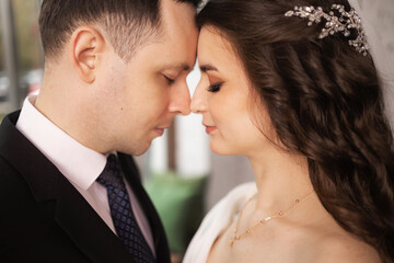 Portrait of a beautiful bride and groom at their wedding day.