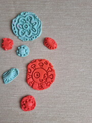 Covid and other respiratory virus molecules made of plasticine. Little toddler education moment in a playful mode. Bacteria made of playdough.