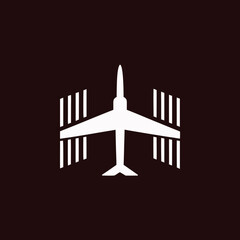 Aeroplane silhouette vector icon on black background, excellent for logo design, aviation labels, and web icons.