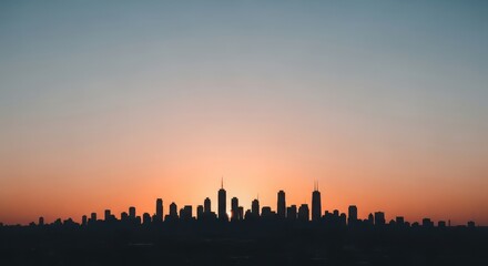 City skyline silhouette against a vibrant sunset sky, creating a stunning urban landscape with warm colors and atmospheric perspective