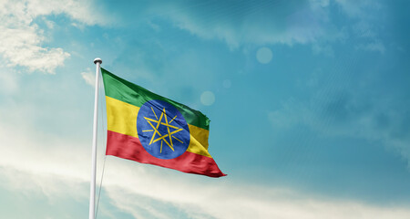 Ethiopia national flag fluttering. The flag blowing in beautiful soft sky. Ethiopia national flag for independence day.