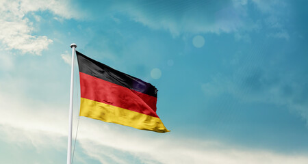 Germany national flag fluttering. The flag blowing in beautiful soft sky. Germany national flag for independence day.