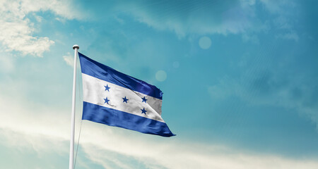 Honduras national flag fluttering. The flag blowing in beautiful soft sky. Honduras national flag for independence day.