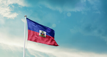 Haiti national flag fluttering. The flag blowing in beautiful soft sky. Haitinational flag for independence day.