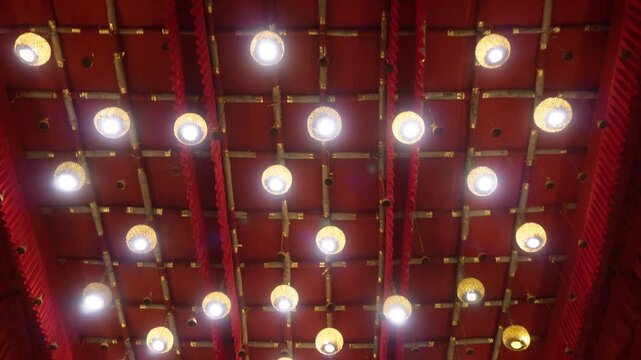 Durga Puja pandal ceiling with grid of bamboo beams 
