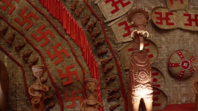 Durga Puja bamboo pandal interior with terracotta style idols