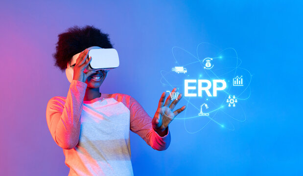 A young person engages with a virtual reality headset, exploring a digital ERP interface that symbolizes innovation in enterprise resource planning and engagement. XDMCP