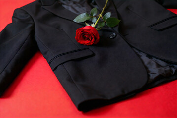 Black Suit Jacket With Red Rose On Red Background